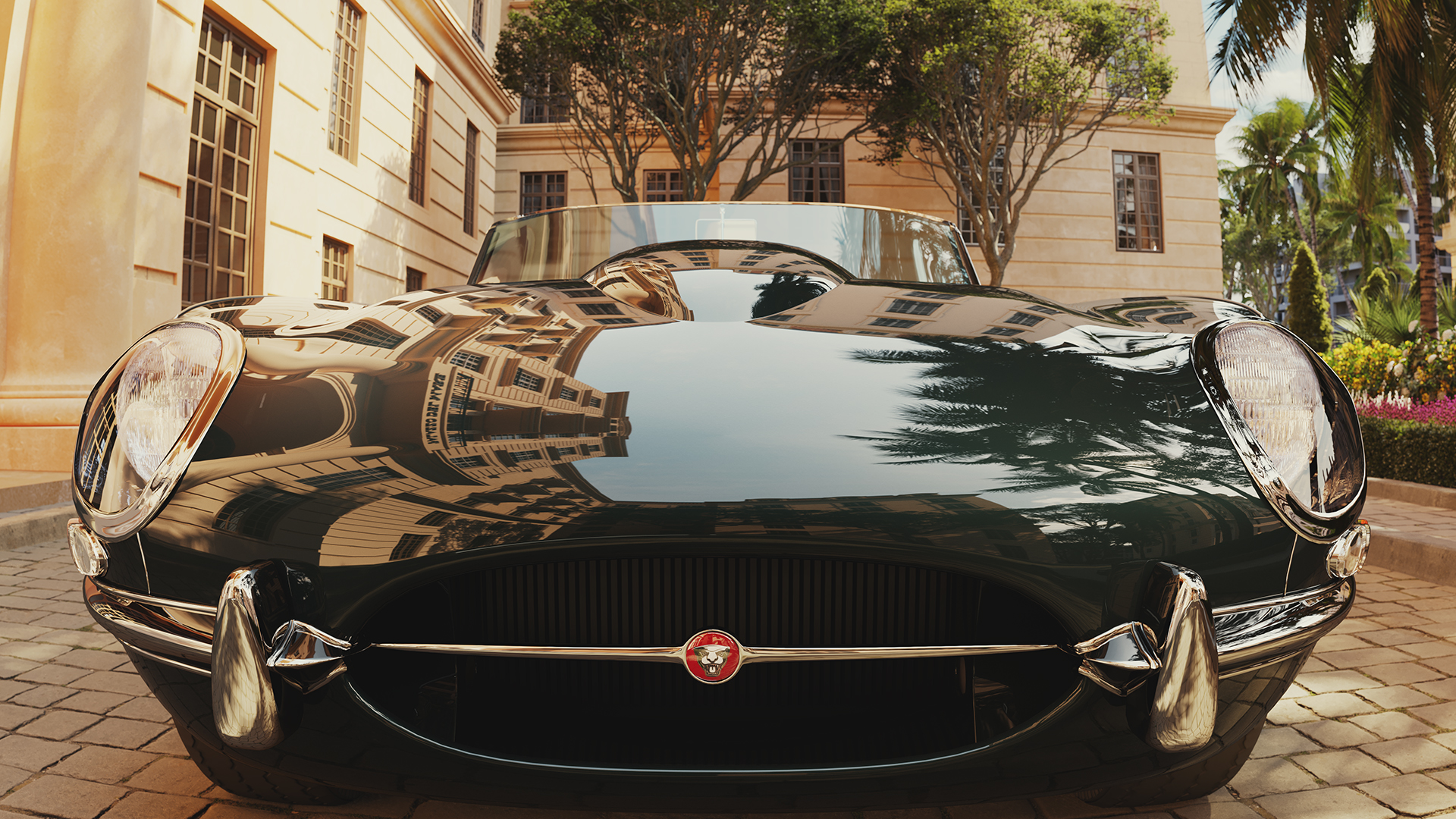 Dark green Jaguar E-Type parked outside Palazzo del Mare.