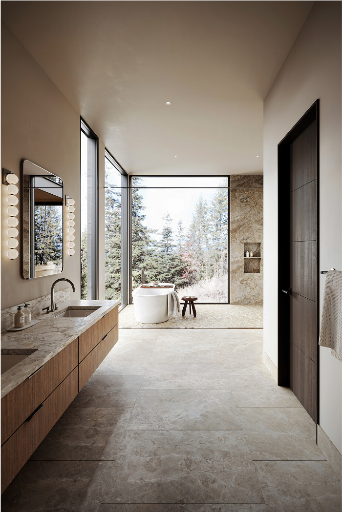Modern bathroom with freestanding tub, marble vanity, and expansive forest views. Idaho Y case study.