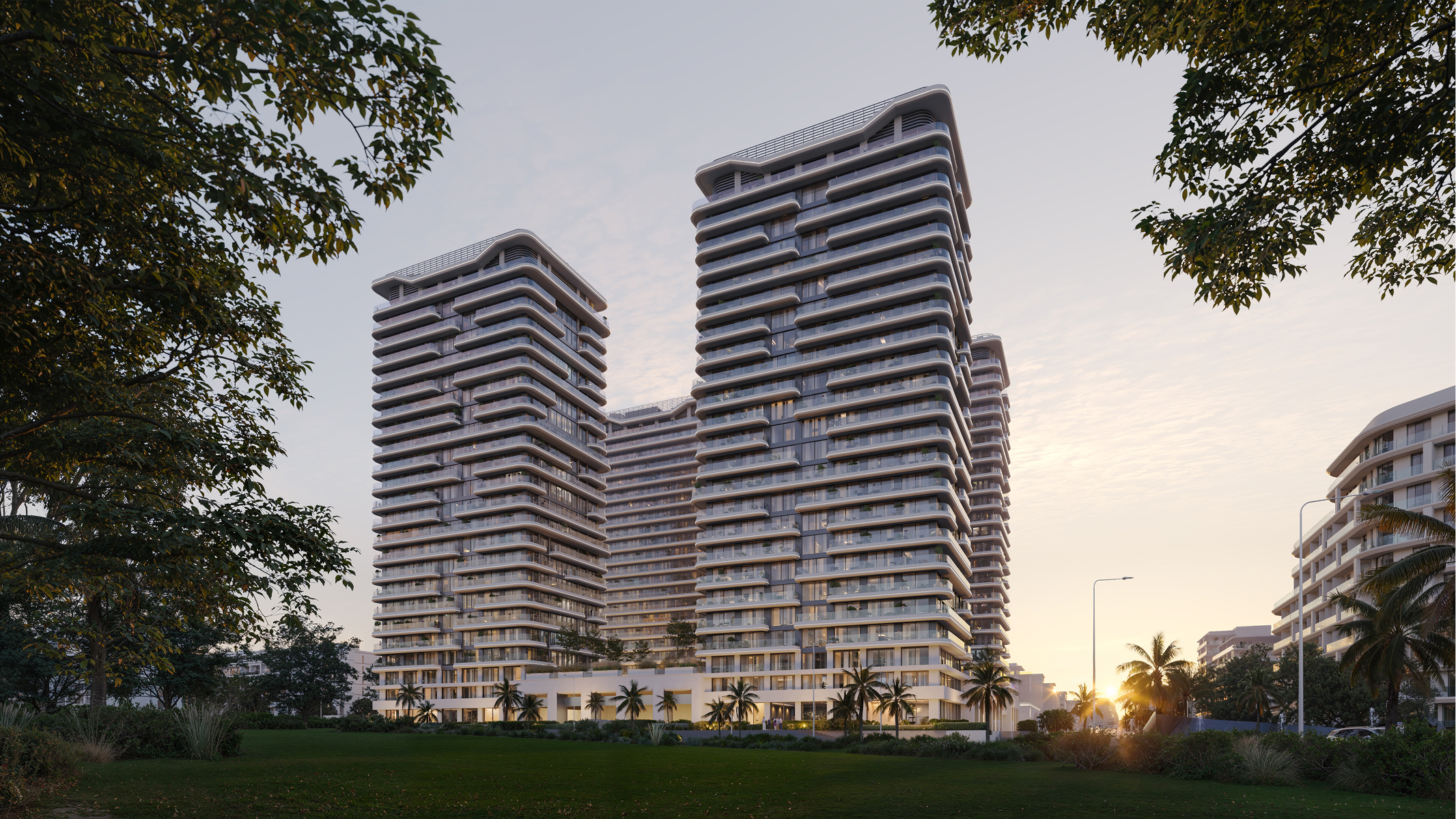 Luxury Sky Park Apartments at sunset. Modern high-rise residential buildings.