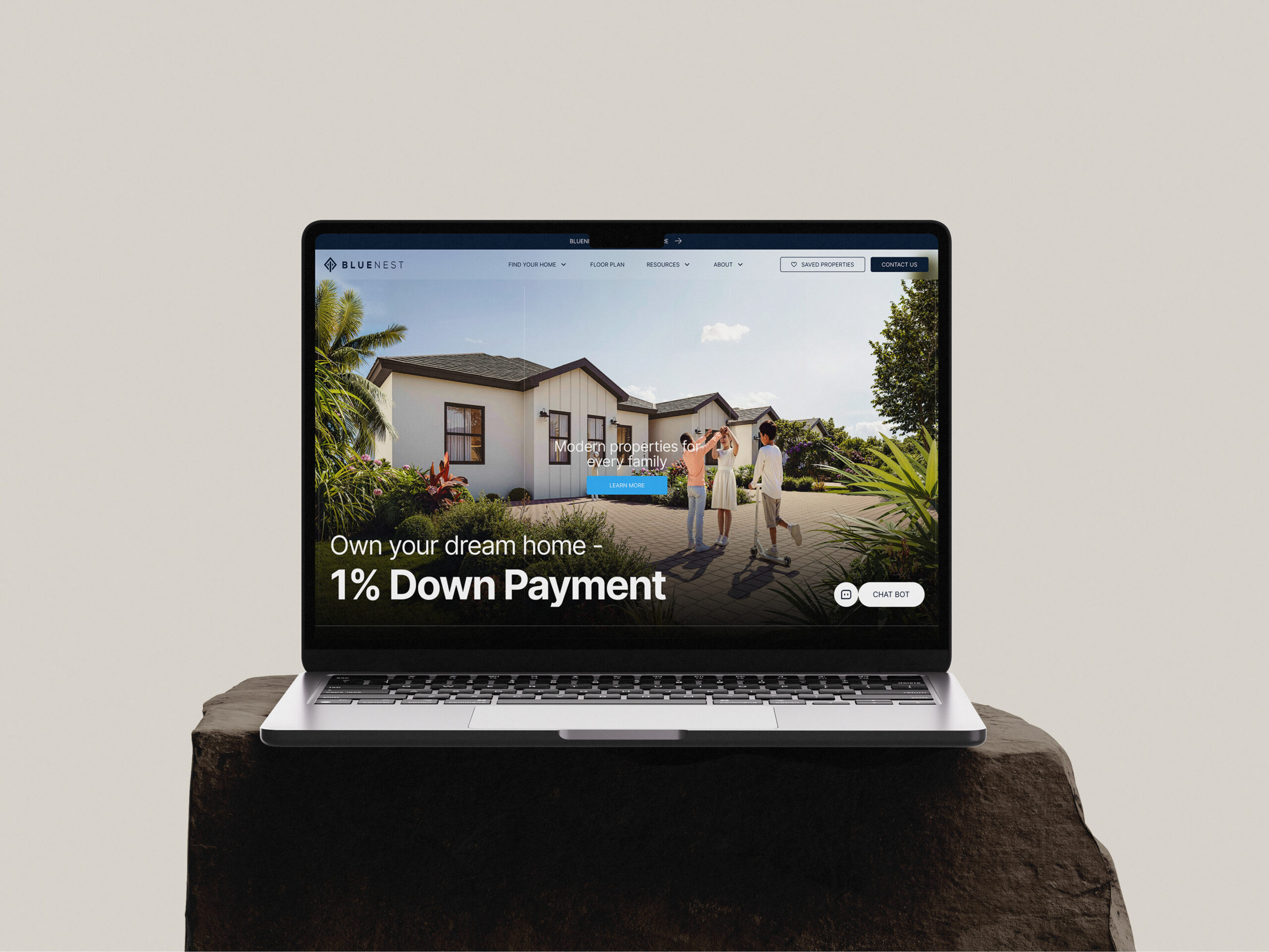 Laptop displaying Bluenest website: 1% down payment on dream homes.