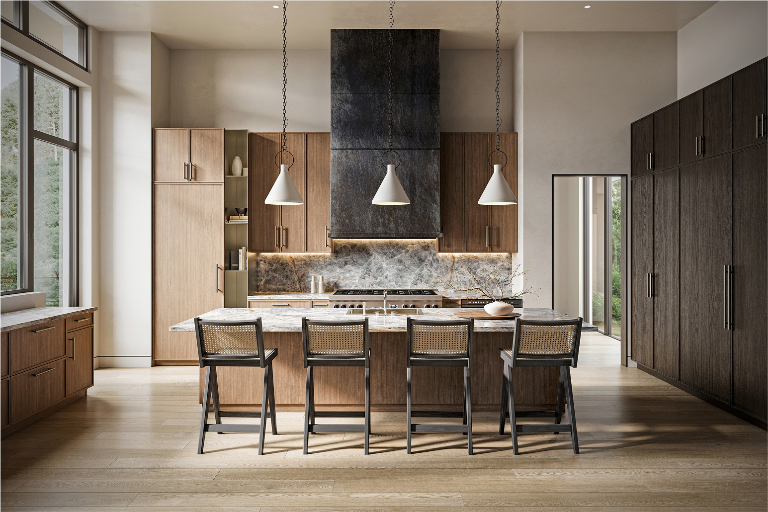 Modern kitchen design with light wood cabinetry, marble countertops, and island seating.
