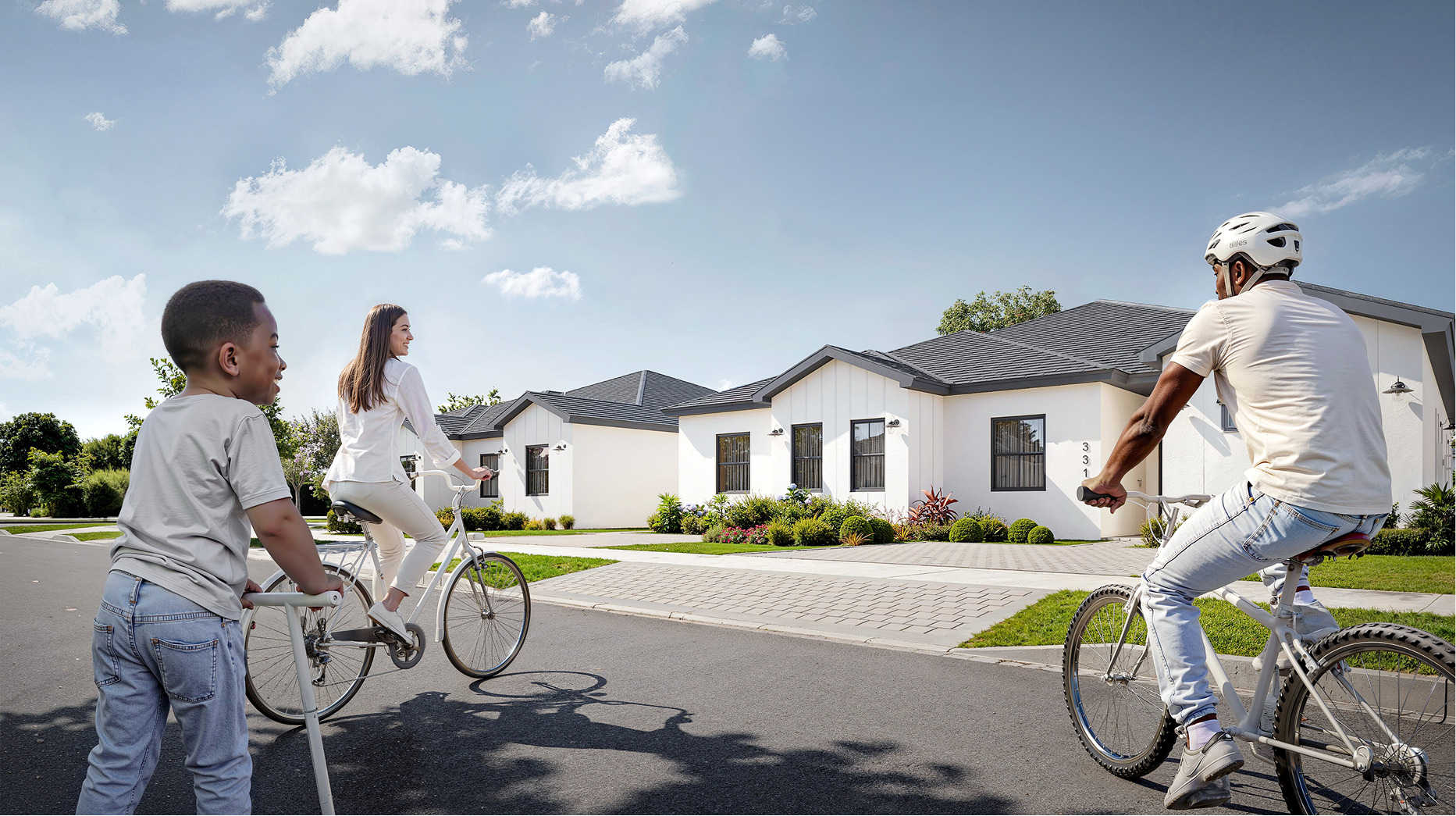 Family biking near new Bluenest homes.