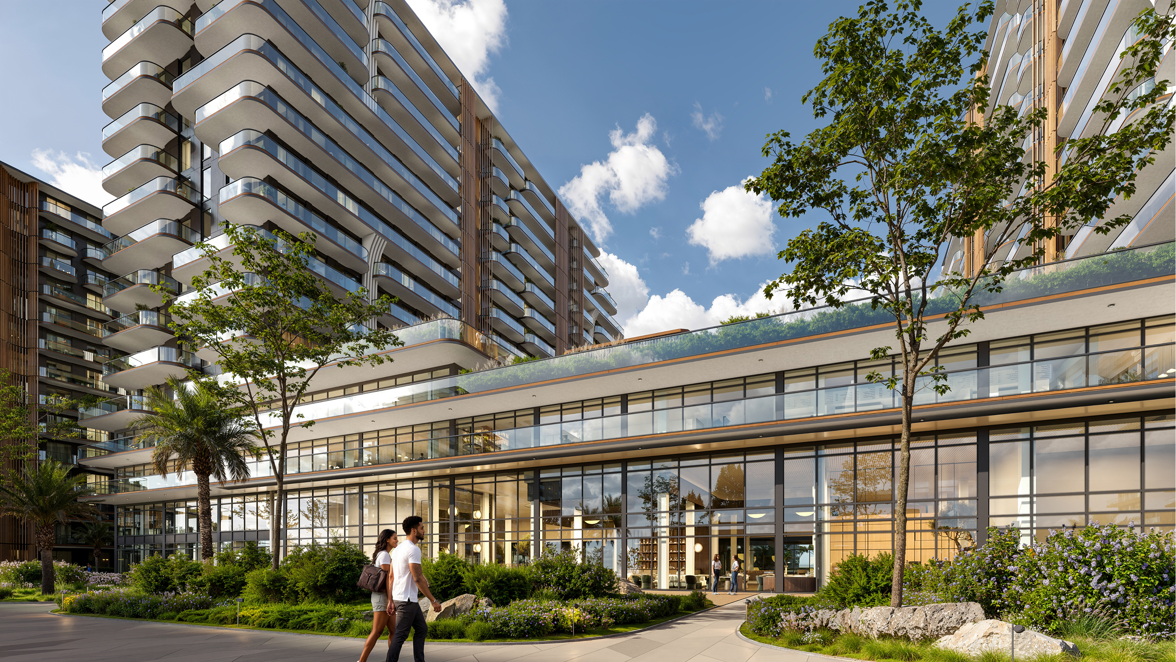 Modern Park Lane apartment building with landscaped grounds and couple walking.