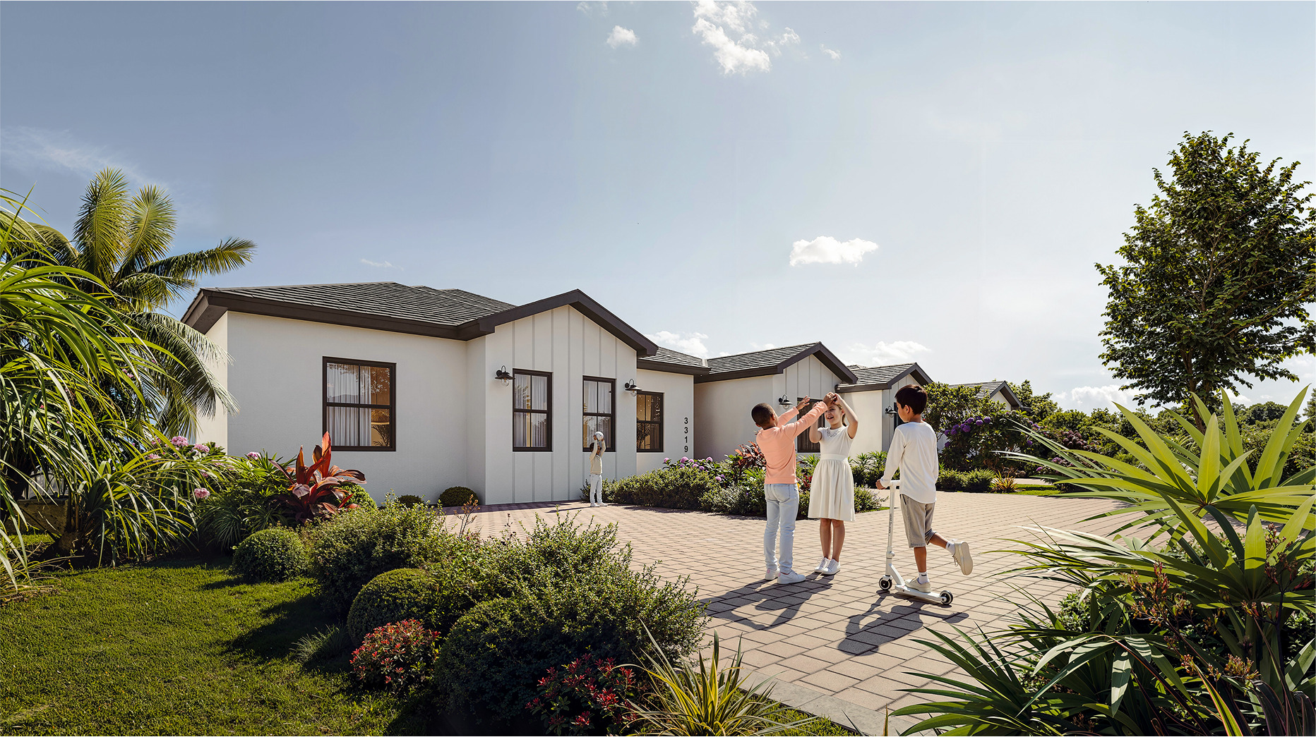 Happy children playing in front of a Bluenest home.