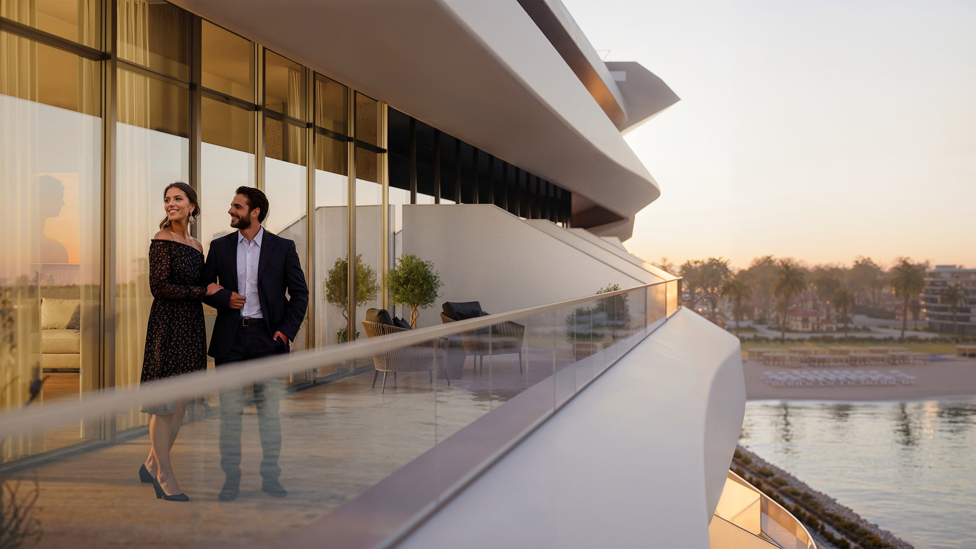 Couple enjoying sunset view from Caspian Dream Liner balcony.