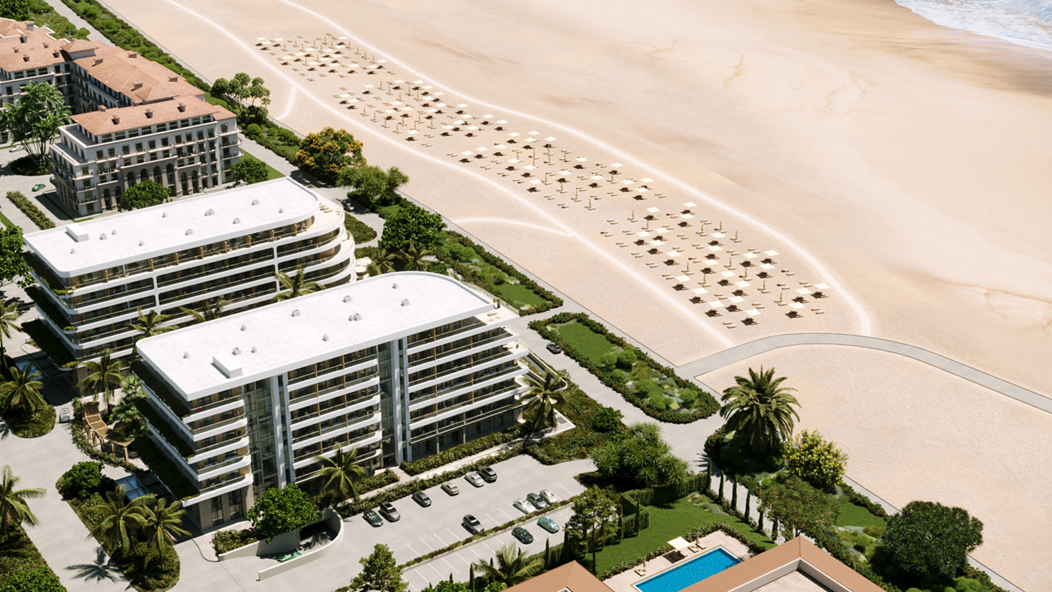 Aerial view of luxury Palm Beach resort with beachfront property and swimming pool.