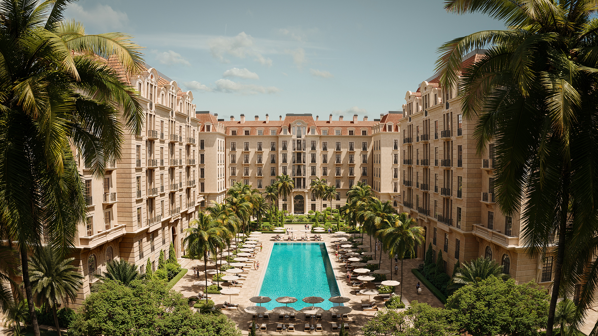 Aerial view of Palazzo del Mare's courtyard with swimming pool and palm trees.