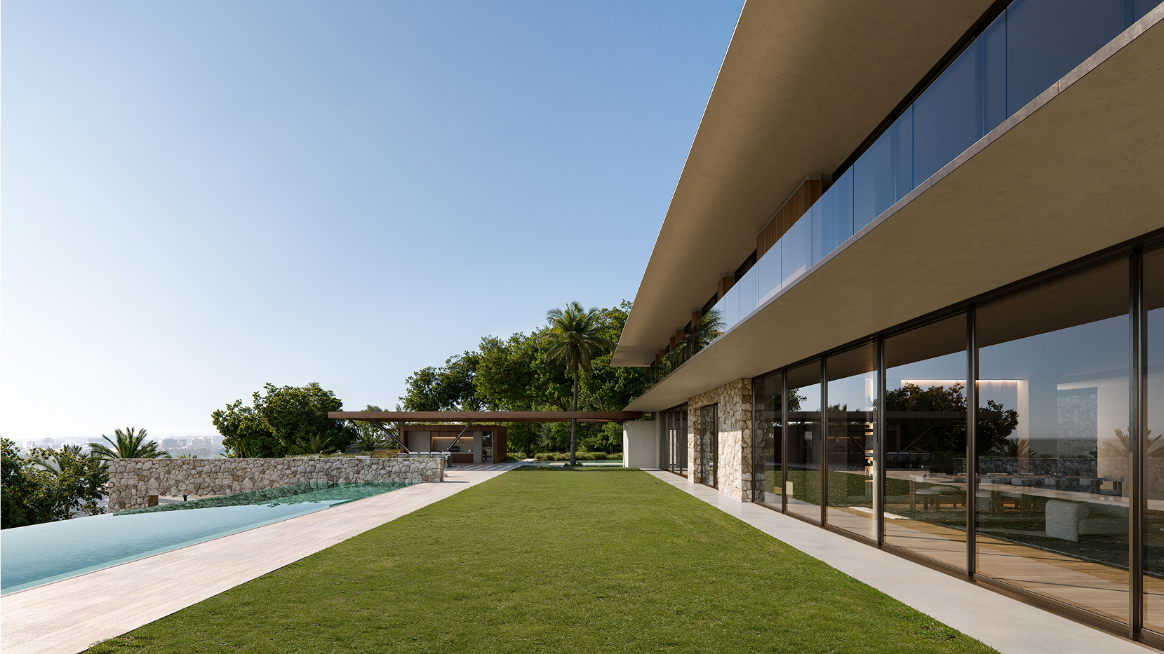 Modern luxury home with infinity pool and expansive lawn overlooking city.