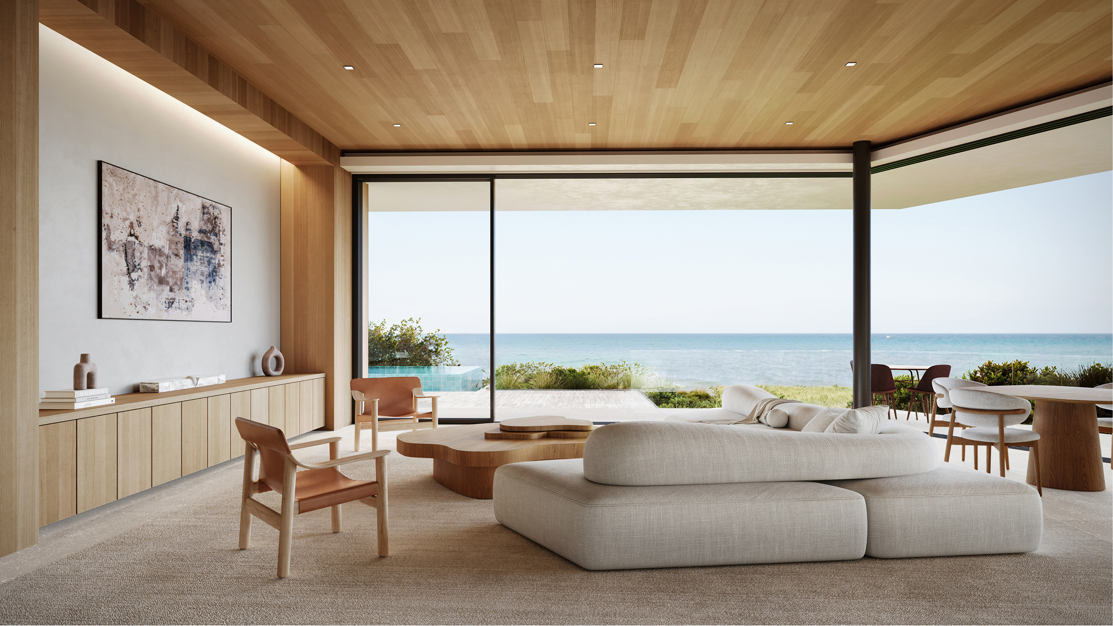 Modern living room with ocean view, light wood accents, and comfortable seating.
