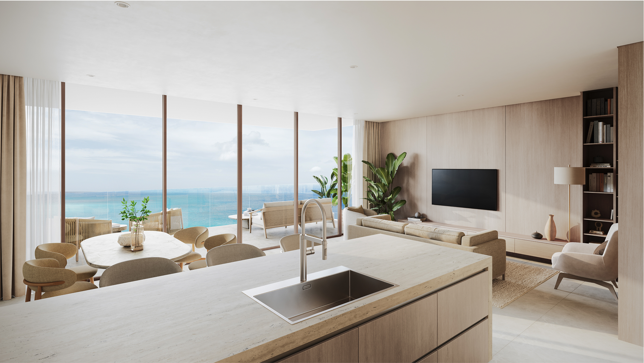 Luxury condo at One Carlisle Bay with ocean views, modern kitchen, and living area.