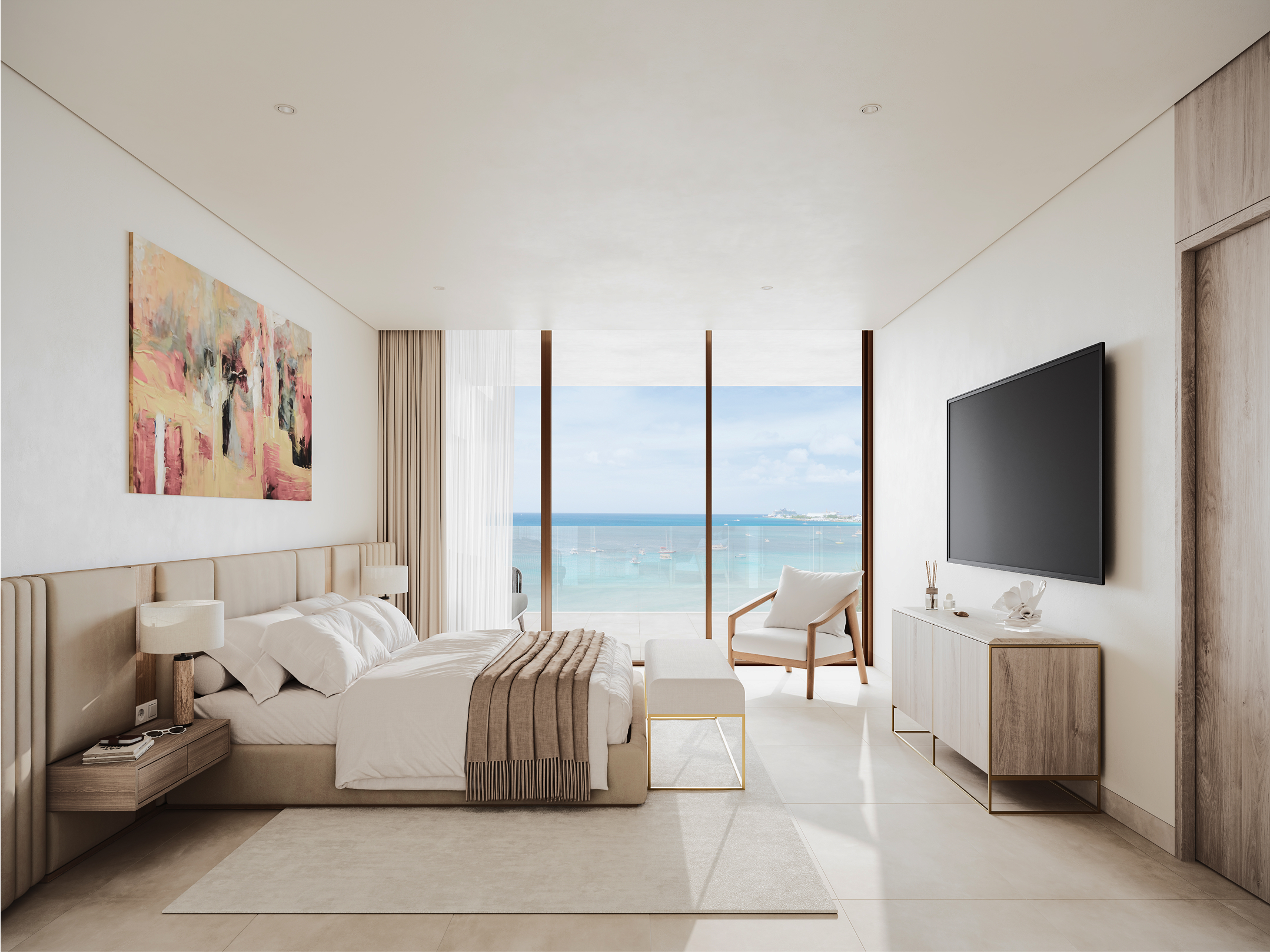 Luxurious beachfront bedroom at One Carlisle Bay, featuring a king-size bed and ocean views.