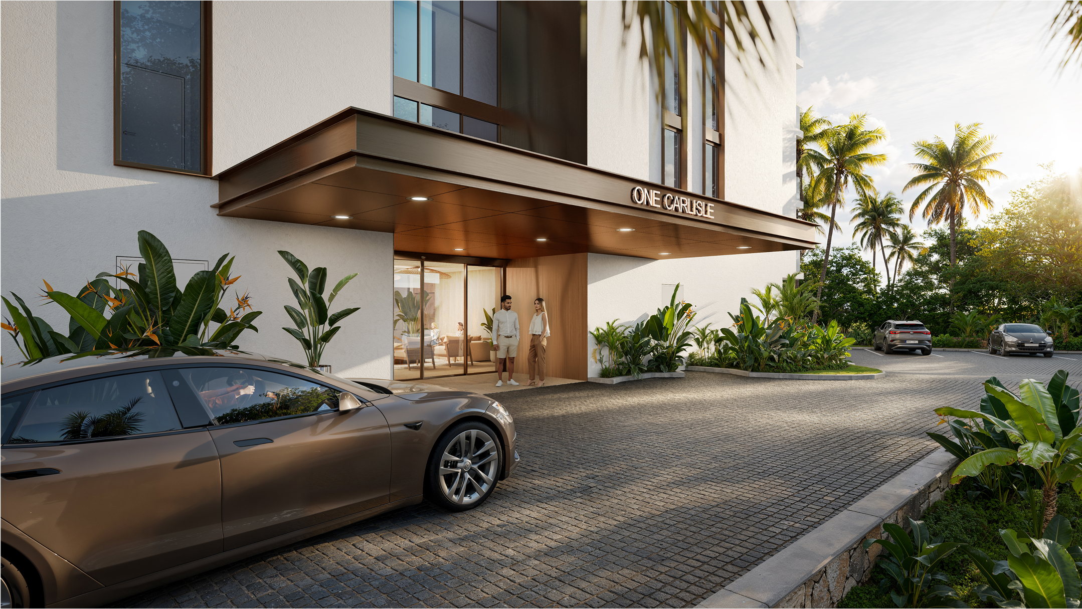 Modern building entrance at One Carlisle Bay; couple stands by glass doors, car parked nearby.
