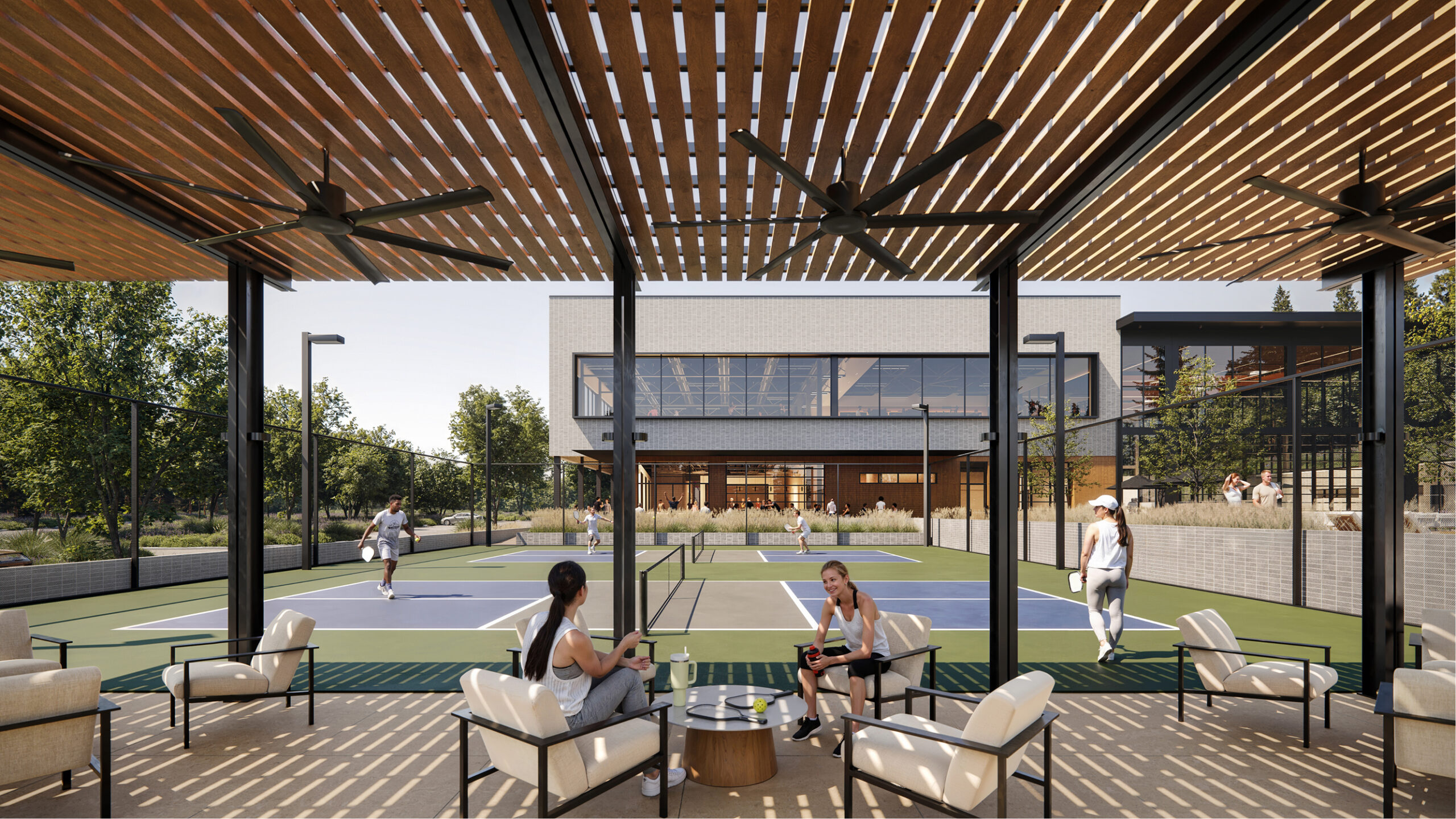 Relaxing patio area overlooking pickleball courts at the Athens Athletic Club.