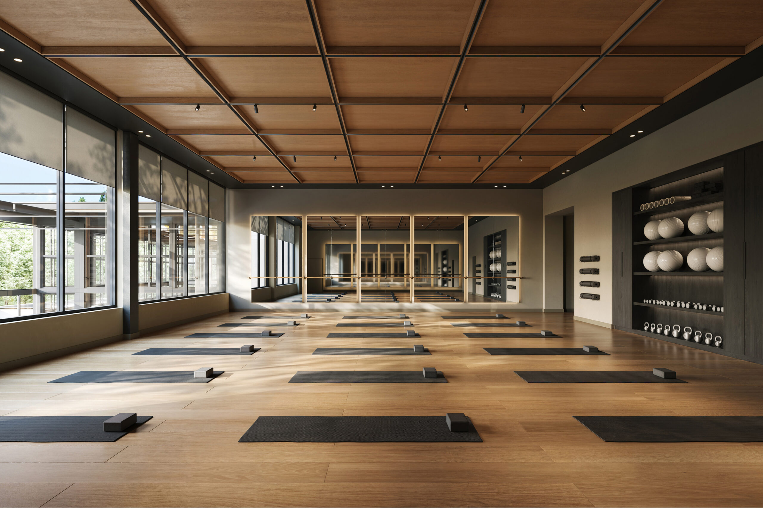 Modern yoga studio at Athens Athletic Club with mats, blocks, and fitness equipment.