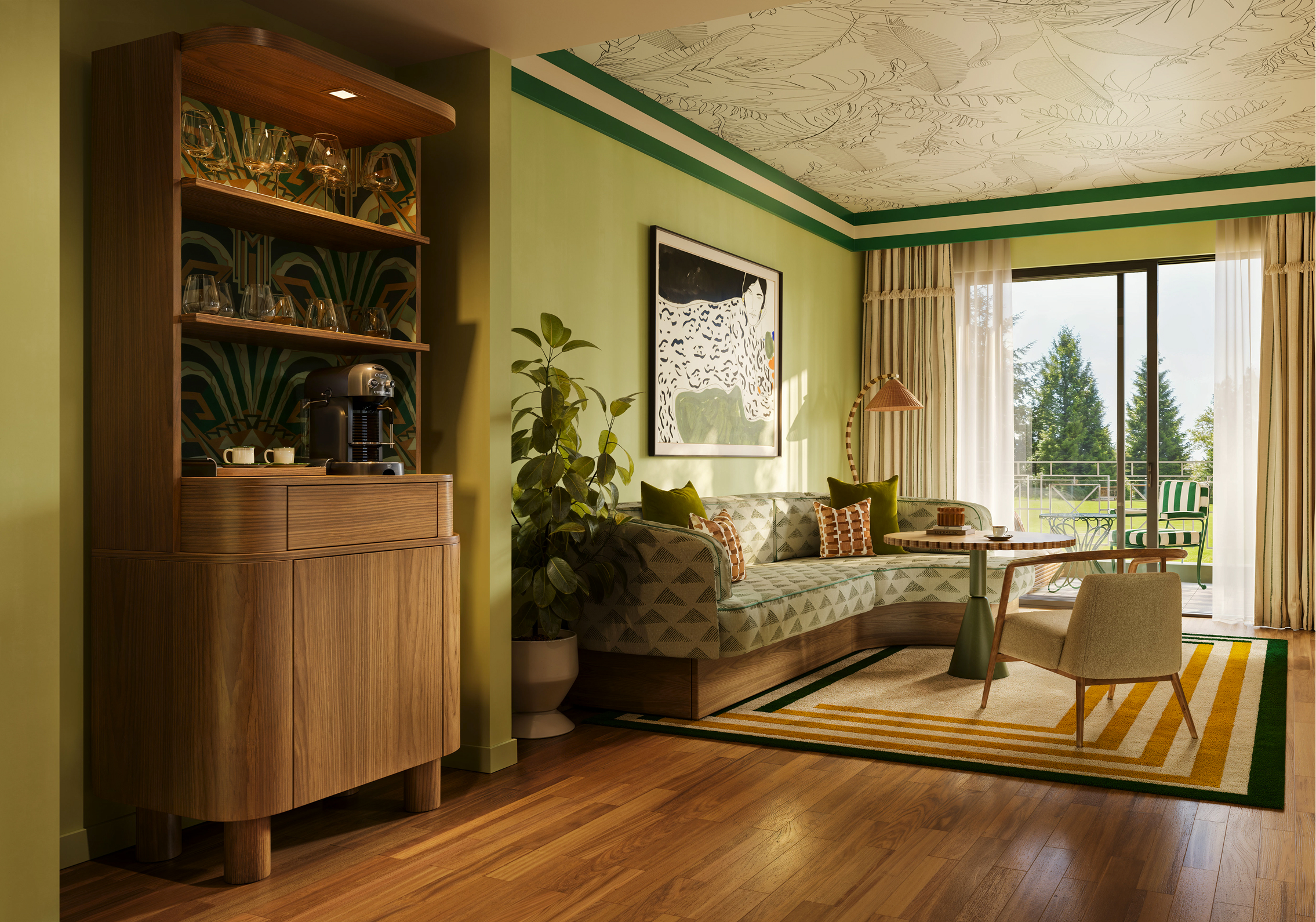 Luxurious Kimpton hotel suite with green accents, curved sofa, and coffee bar.
