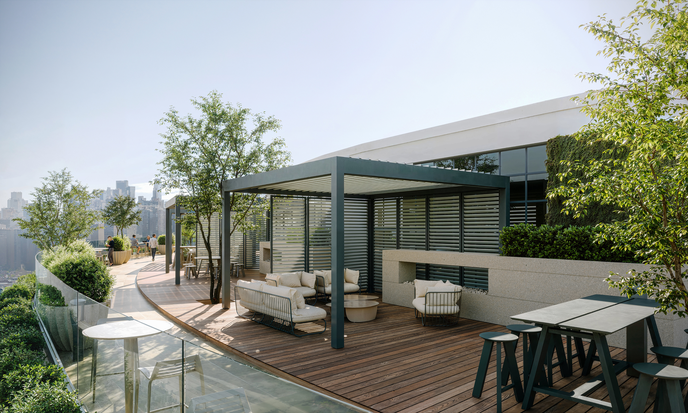 Modern rooftop terrace with Landscapeforms furniture, pergola, and city views.