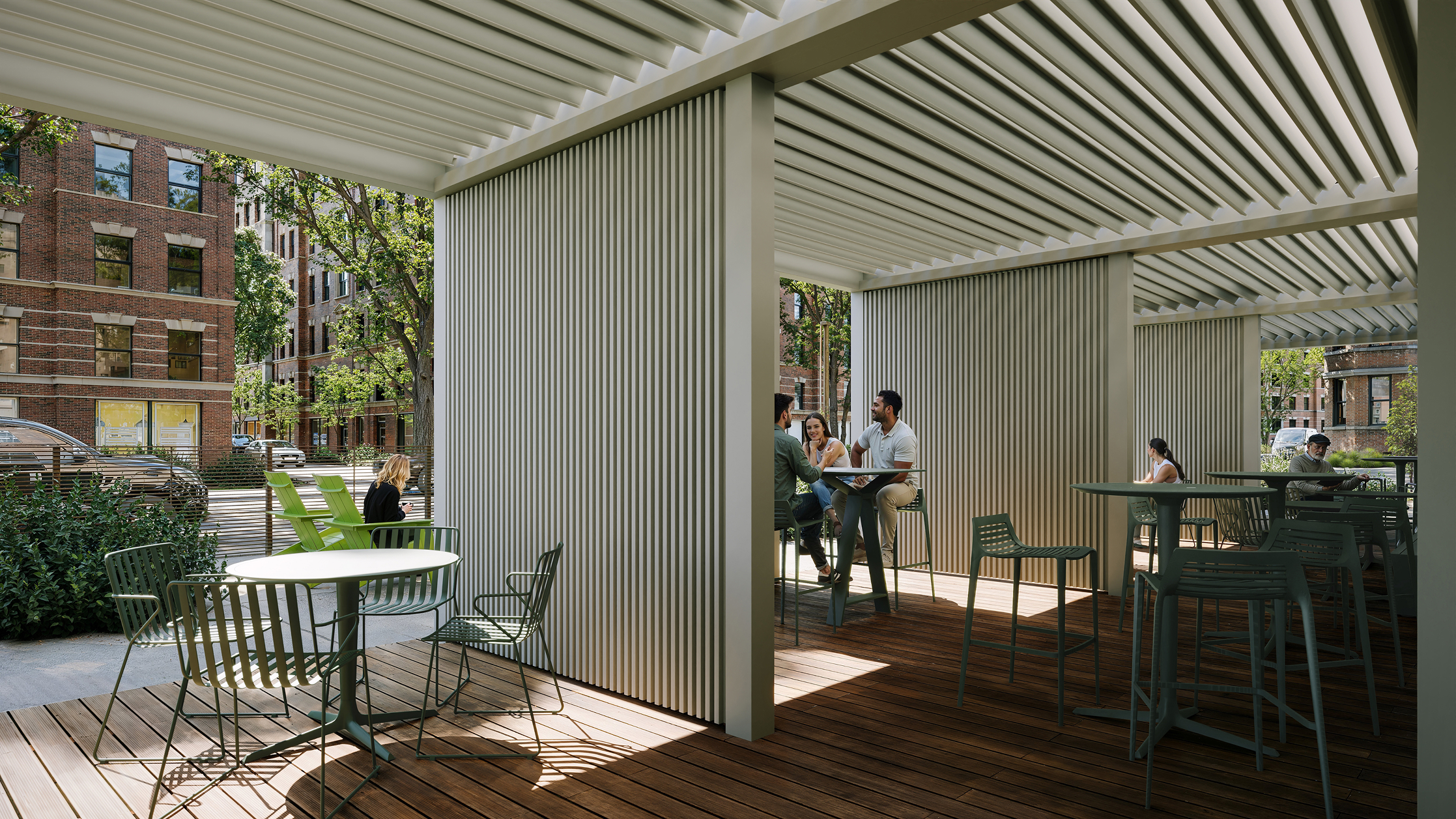 Modern outdoor seating area with tables and chairs under a pergola.