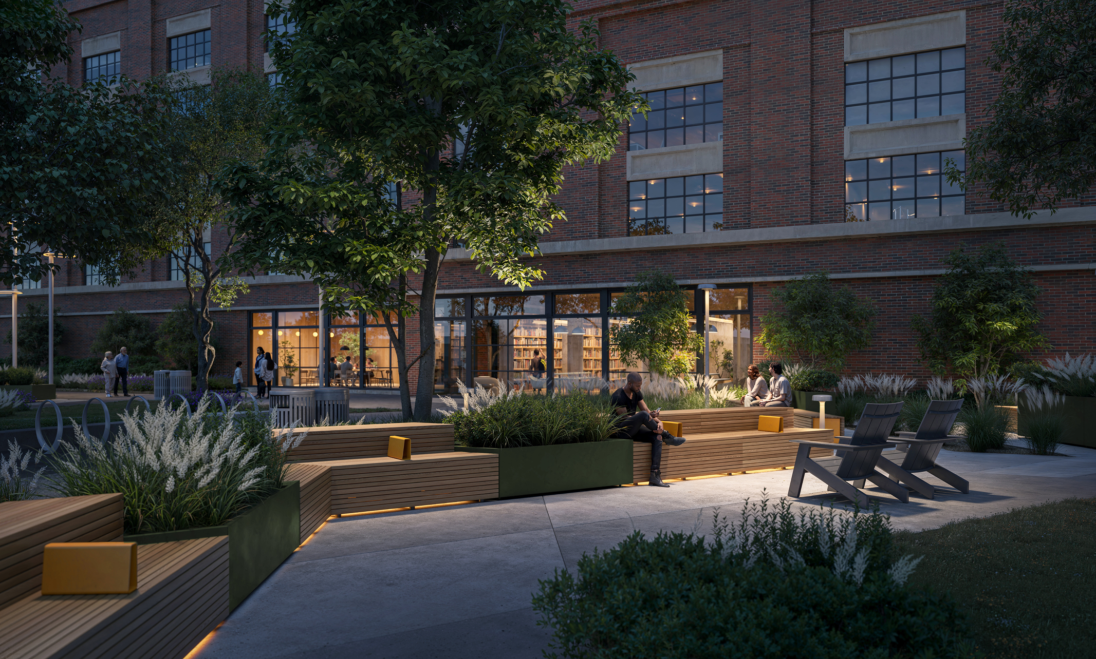 Modern outdoor seating area with wooden benches, greenery, and a brick building backdrop.